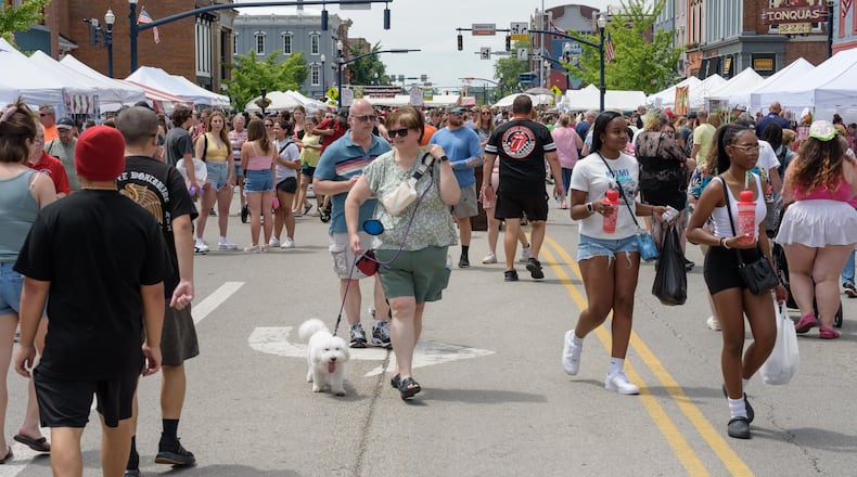 The 48th annual Troy Strawberry Festival took place on Saturday, June 1 and Sunday, June 2, 2024 in downtown Troy and the Great Miami River levee. Featured festivities included strawberry themed foods, vendors, live music and more. Here are scenes from Saturday plus a behind the scenes glimpse at the making of the festival’s famous strawberry donuts by Troy Music Boosters volunteers at Troy Memorial Stadium. This year’s festival theme was Blooming Berries. TOM GILLIAM / CONTRIBUTING PHOTOGRAPHER