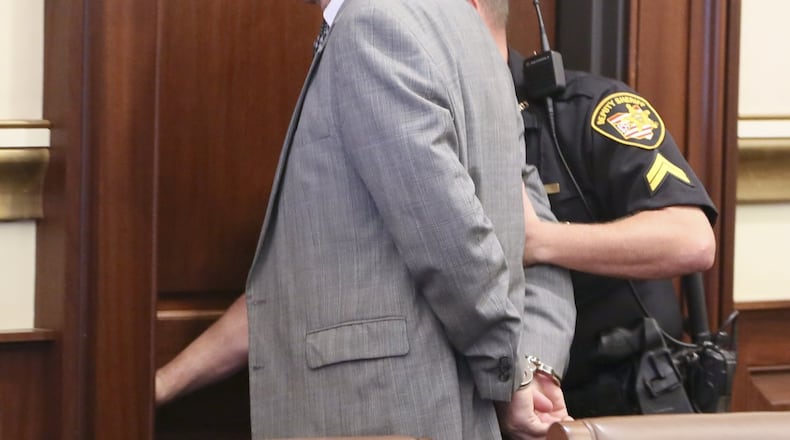 Former Warren County lawmaker Pete Beck is led from the courtroom in handcuffs on Thursday after being sentenced to four years in prison by Hamilton County Common Pleas Judge John Andrew West. The sentence comes two months after Beck was found guilty on 13 0f 38 charges related to his involvement in Christopher Technologies, a failed start-up tech firm.