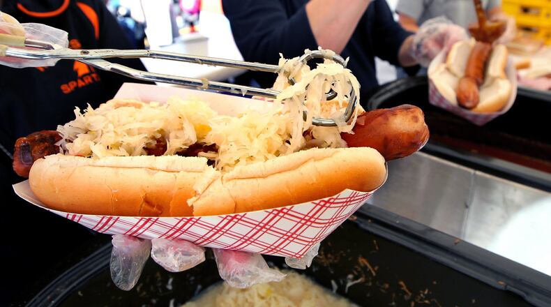 A giant hot dog is topped with sauerkraut at a past Ohio Sauerkraut Festival.
