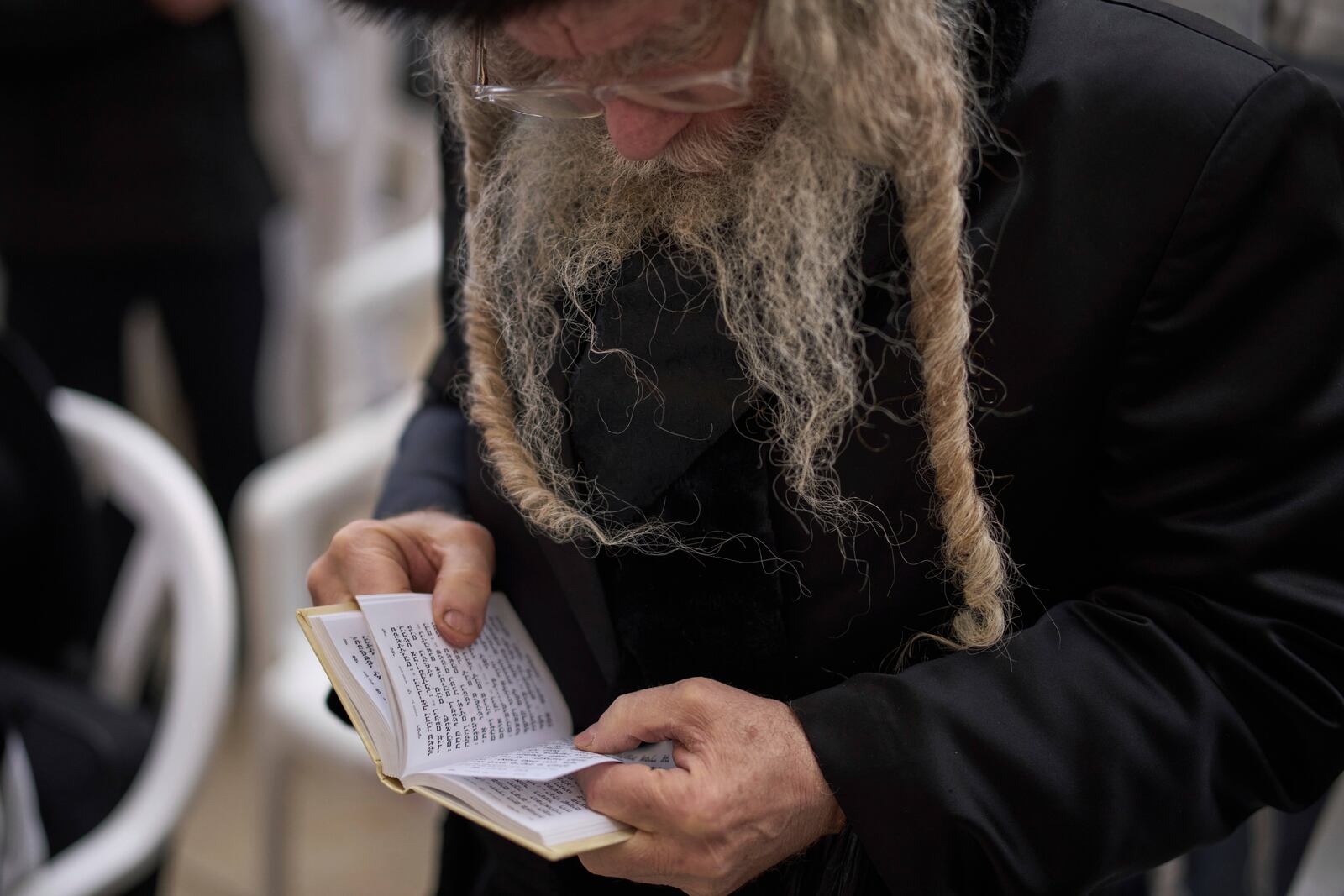 An ultra-Orthodox Jew participates in a blessing during the holiday of Passover, at the Western Wall, the holiest site where Jews can pray, in the Old City of Jerusalem, Tuesday, April 15, 2025. (AP Photo/Leo Correa)