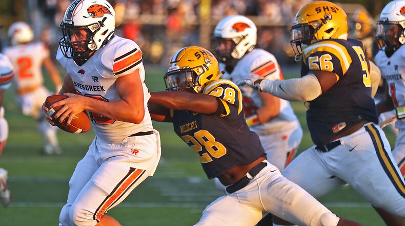 Springfield's Jaivian Norman sacks Beavercreek quarterback Spencer Johnson in Friday's game at Springfield. BILL LACKEY/STAFF