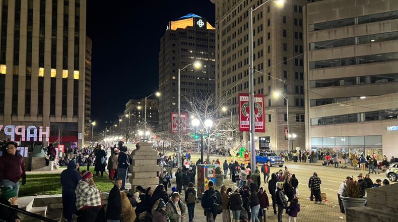 A scene from downtown Dayton after people scrambled to leave the area following a gunshot heard Friday, Nov. 25, 2022, during the Children's Parade at the Dayton Holiday Festival. ALLISON SWANSON/STAFF