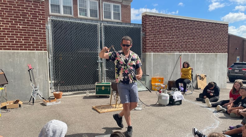 Darren Goodman shows glassblowing to students at Berry Intermediate School In Lebanon recently. AVERY KREEMER/STAFF