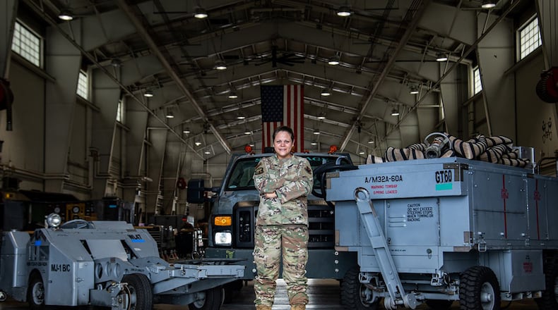 Tech. Sgt. Natalia Wood, 20th Equipment Maintenance Squadron aerospace ground equipment maintenance Airman, poses in her workplace while showcasing the 20th Fighter Wing assets she maintains at Shaw Air Force Base, S.C., Aug. 25. In her role on the women’s initiative team, she helped champion the effort to ensure practical lactation spaces and breastmilk storage for women in the Department of the Air Force. U.S. Air Force photo/Staff Sgt. Sean Sweeney