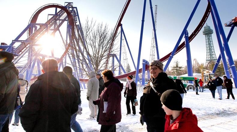 Members of the American Coaster Enthusiasts group get an close-up look at the new Banshee roller coaster being built at Kings Island during a visit to the park Saturday, Dec. 7, 2013. NICK DAGGY / STAFF