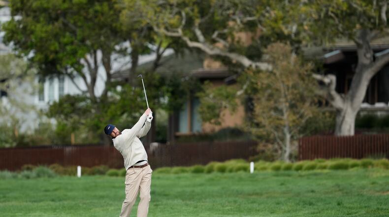 Kansas City Chiefs' Travis Kelce hits from the second fairway at Pebble Beach Golf Links during the second round of the AT&T Pebble Beach Pro-Am golf tournament in Pebble Beach, Calif., Friday, Feb. 13, 2026. (AP Photo/Godofredo A. Vásquez)