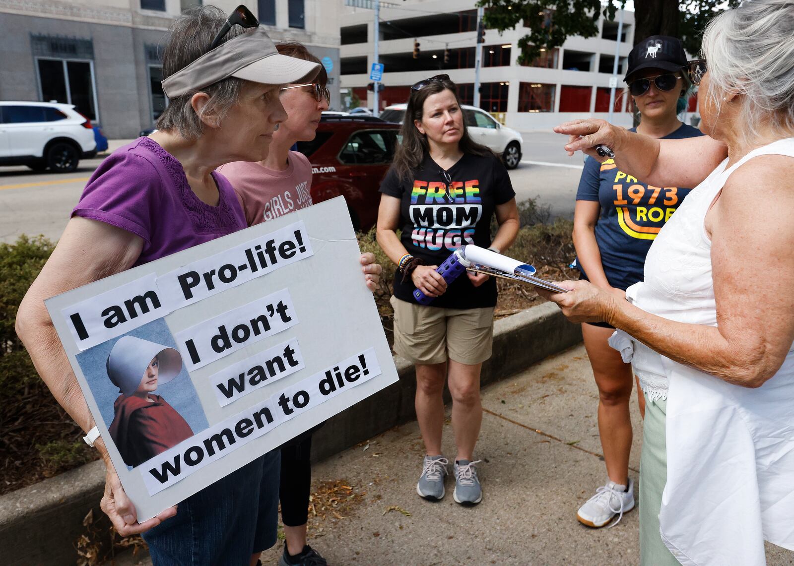 Approximately 100 people turned out Monday, June 24, 2024 at the Federal Building in Dayton to protest anti-abortion efforts across the country and the Supreme Court's Dobbs decision from two years ago. MARSHALL GORBY\STAFF