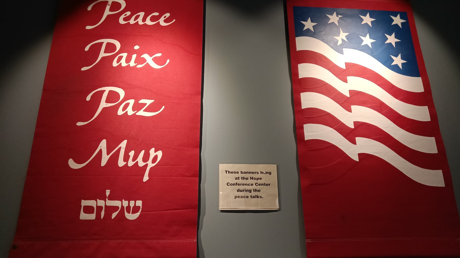 Among the artifacts on display are these banners that hung at the Hope Conference Center during the peace talks. MARY RAMEY/CONTRIBUTED