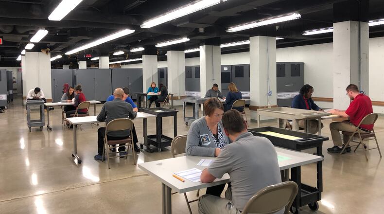 Montgomery County Board of Elections staff hand count ballots in close races. STAFF/BONNIE MEIBERS