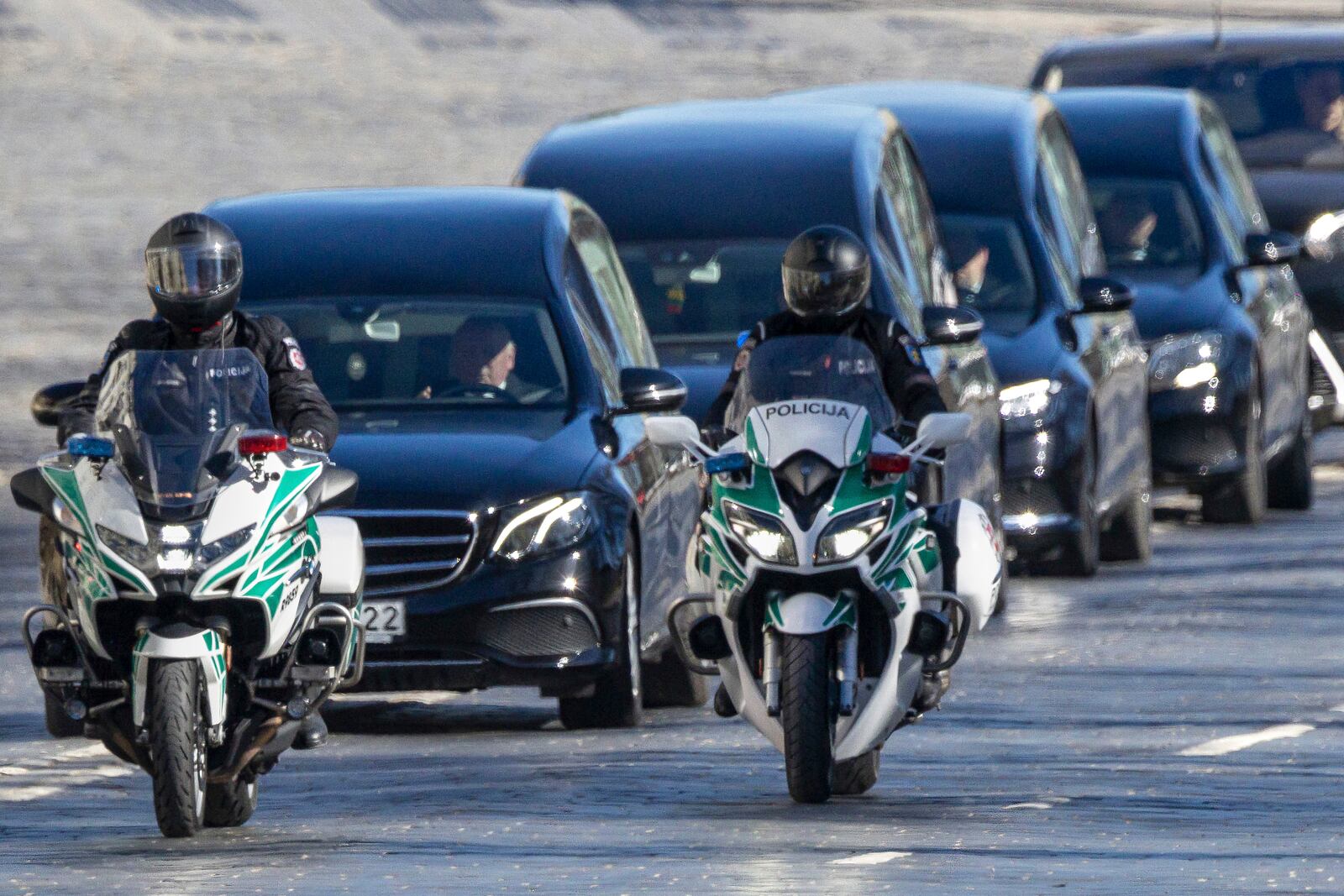A motorcade of catafalques rolls to attend a solemn farewell ceremony at Cathedral Square in Vilnius, Lithuania, Thursday, April 3, 2025 for the US soldiers who died during training exercise. (AP Photo/Mindaugas Kulbis)