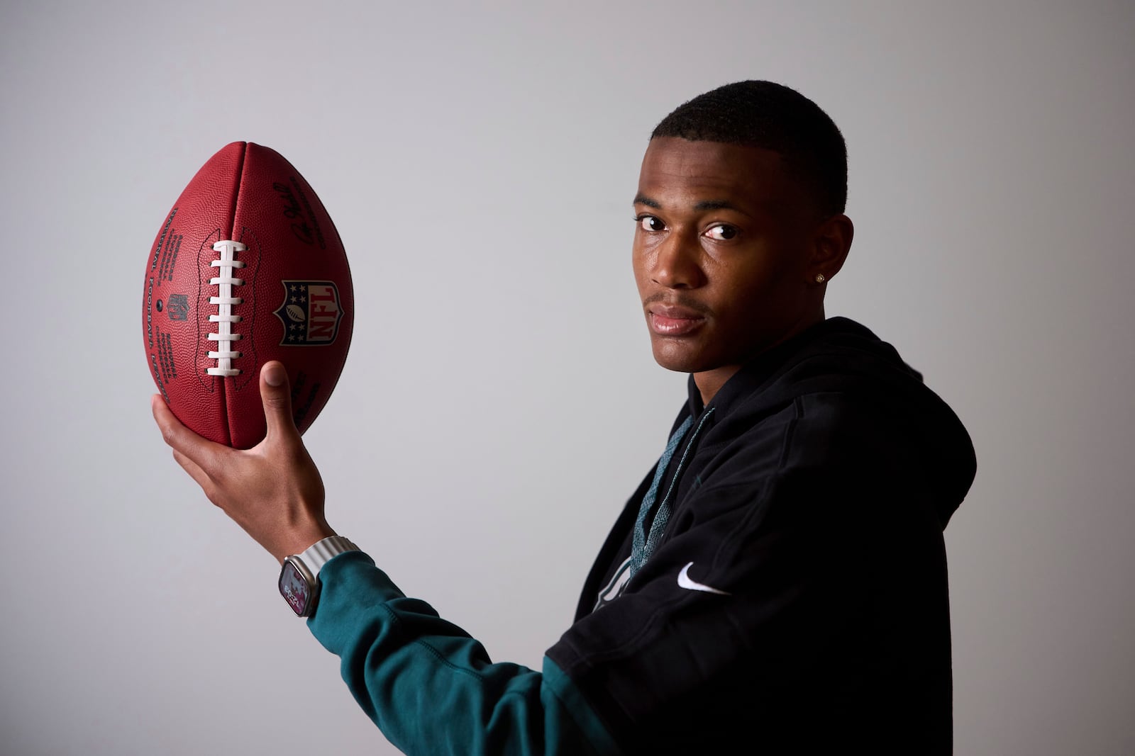 Philadelphia Eagles DeVonta Smith holds the ball as he poses for a photo ahead of an interview with the Associated Press in Barcelona, Spain, Monday, May 12, 2025. (AP Photo/Emilio Morenatti)
