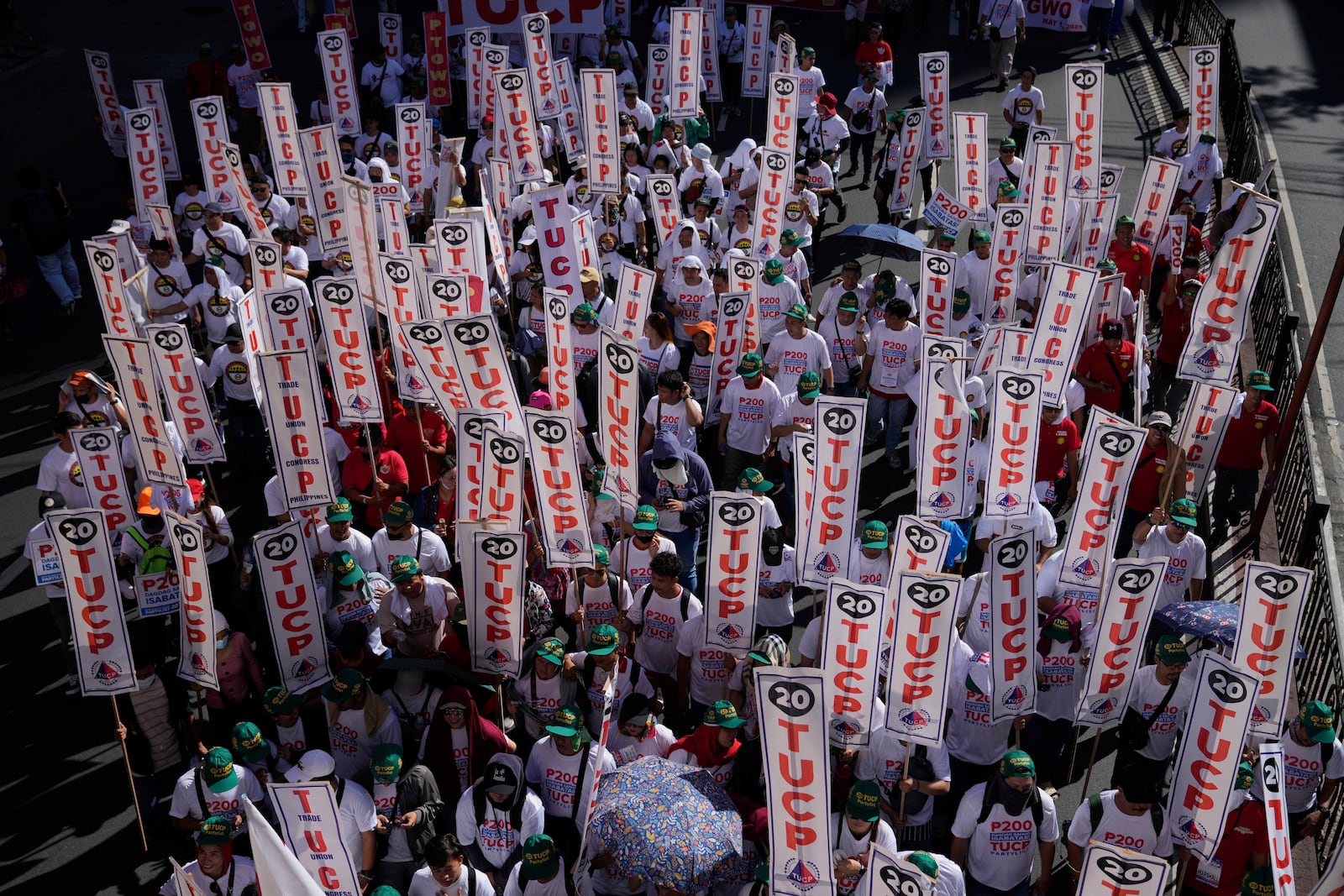 Activists and workers hold banners of the Trade Union Congress of the Philippines during a May Day rally in Manila, Philippines, Thursday, May 1, 2025. (AP Photo/Aaron Favila)