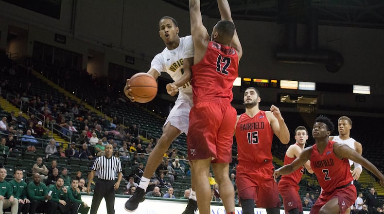 Wright State freshman Jaylon hall tries to make a pass around Fairfield’s Kevin Senghorne-Patterson during Sunday’s game at the Nutter Center. Allison Rodriguez/CONTRIBUTED