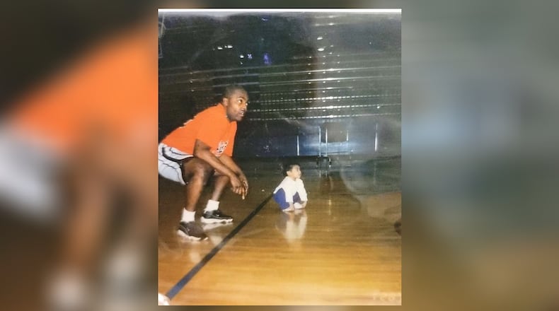 Two-year-old Olivia Trice with her dad, longtime area basketball coach – and current Wright State assistant – Travis Trice in a gym. CONTRIBUTED PHOTO