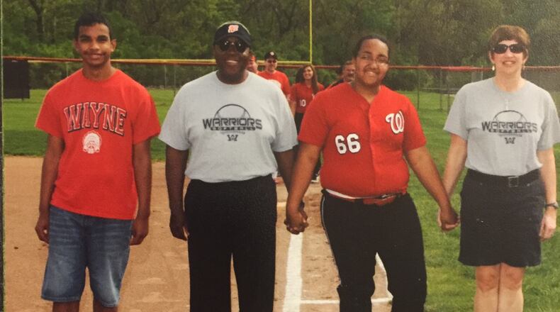 Huber Heights School Board Member Bill Harris, second from left, with son Nick, daughter Rachael and wife Robin. Harris’ two children graduated from Wayne High School. CONTRIBUTED
