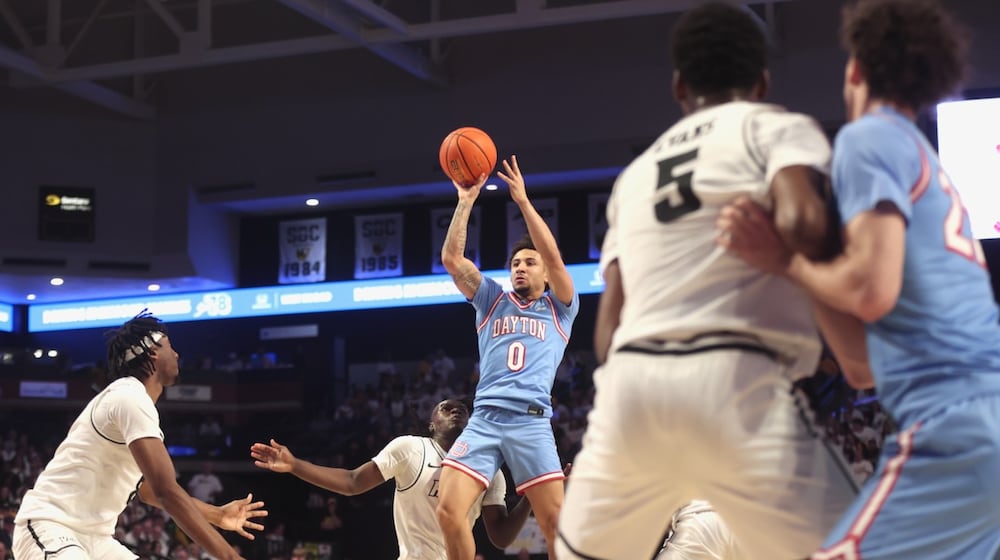 Dayton's Javon Bennett shoots against Virginia Commonwealth on Friday, Feb. 6, 2026, at the Siegel Center in Richmond, Va. David Jablonski/Staff