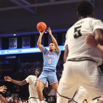 Dayton's Javon Bennett shoots against Virginia Commonwealth on Friday, Feb. 6, 2026, at the Siegel Center in Richmond, Va. David Jablonski/Staff