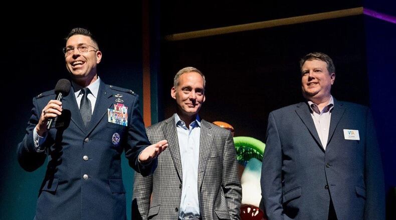 Col. Thomas Sherman (left), 88th Air Base Wing and installation commander at Wright-Patterson Air Force Base, Jeff Hoagland (center), president and CEO of Dayton Development Coalition, and Ty Sutton, CEO of Victoria Theatre Association, give opening remarks Nov. 20 at the SpongeBob Musical performance at the Benjamin & Marian Schuster Performing Arts Center in downtown Dayton. (Contributed photo)
