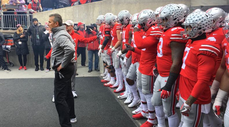 Ohio State’s Urban Meyer waits to lead the team onto the field before a game against Michigan State on Saturday, Nov. 11, 2017, at Ohio Stadium in Columbus. David Jablonski/Staff