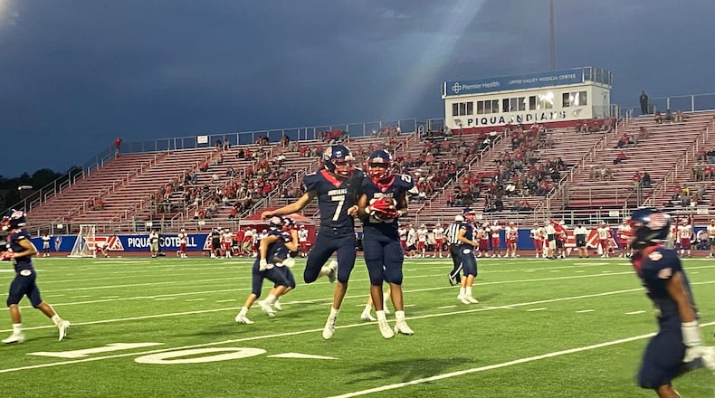 Piqua’s Brady Uohl (7) and Bryson Roberts celebrate