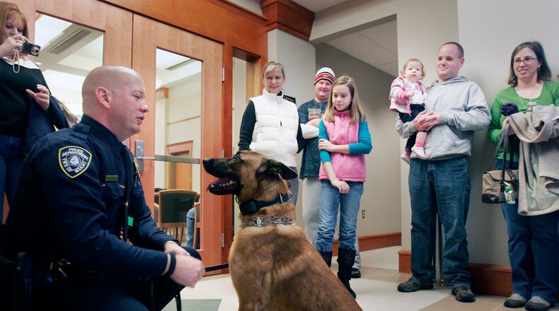 Miami Twp. Police Department K-9 officer Coron, shown here is this file photo, is being sold to his handler as the department’s K-9 unit is disbanding. The 8-year-old Belgian Malinois has been with the department since it started the K-9 unit in 2011. JIM NOELKER/STAFF