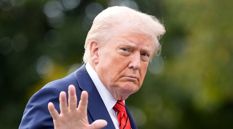 President Donald Trump walks on the South Lawn after arriving on Marine One at the White House, Friday, Oct. 10, 2025, in Washington. (AP Photo/Alex Brandon)