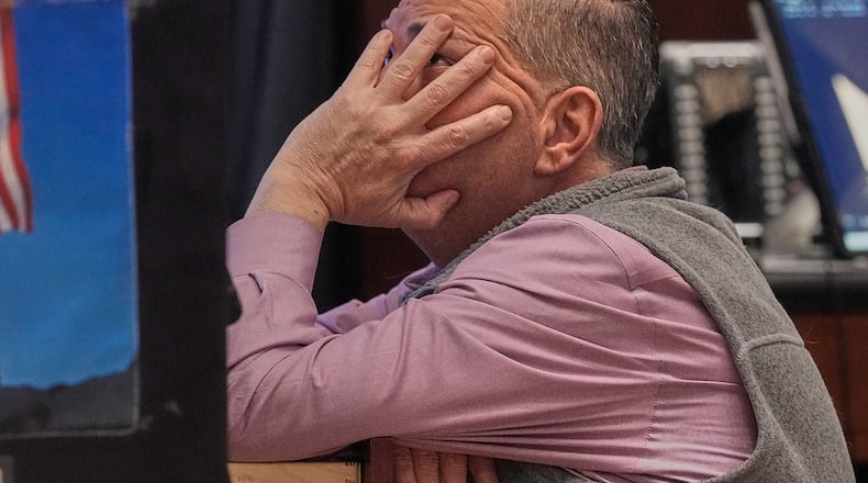 Trader Jonathan Mueller works on the floor of the New York Stock Exchange, Tuesday, Feb. 3, 2026. (AP Photo/Richard Drew)