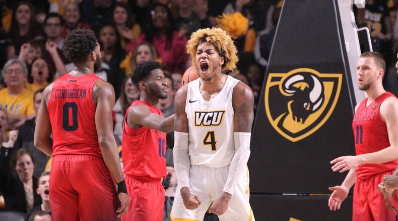Virginia Commonwealth’s Justin Tillman reacts after a basket against Dayton on Saturday, Feb. 10, 2018, at the Siegel Center in Richmond, Va. David Jablonski/Staff