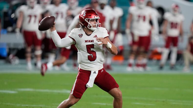 Miami (Ohio) quarterback Brett Gabbert throws a pass during the first half of an NCAA college football game against Miami, Friday, Sept. 1, 2023, in Miami Gardens, Fla. (AP Photo/Wilfredo Lee)