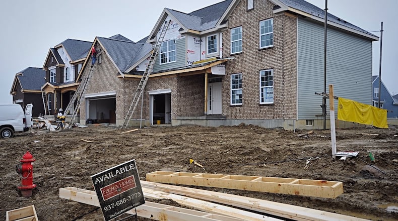 These houses on Linden Silver Dr. are some of 132 being built in the Carriage Trails subdivision in Huber Heights. STAFF/MARSHALL GORBY