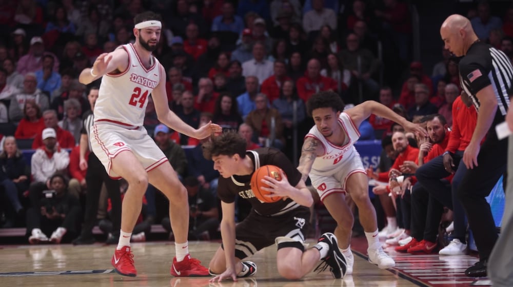 Dayton's Jacob Conner, left, and Javon Bennett, right, defend against St. Bonaventure on Tuesday, Feb. 3, 2026, at UD Arena. David Jablonski/Staff