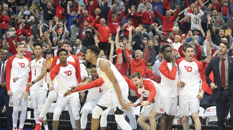 Dayton's bench reacts after a 3-pointer by Charles Cooke late in the second half against Davidson in the Atlantic 10 tournament quarterfinals on March 10, 2017, at PPG Paints Arena in Pittsburgh.