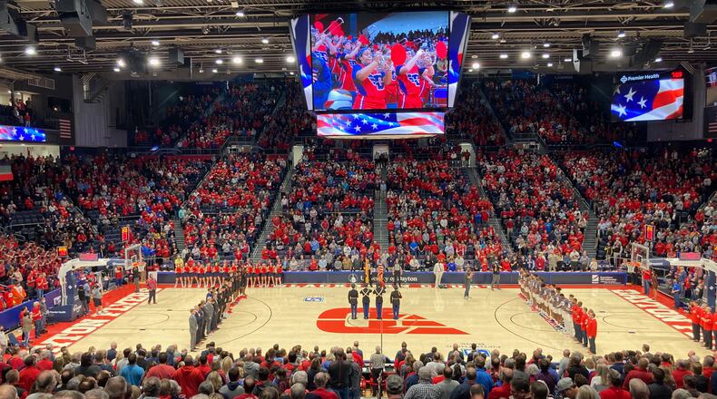 The scene at UD Arena as Dayton and Illinois-Chicago stand for the national anthem on Tuesday, Nov. 9, 2021, at UD Arena. David Jablonski/Staff