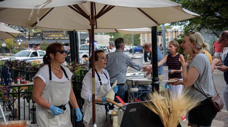 Snack and sip your way through the Oregon District in downtown Dayton on Saturday, Sept. 16 from noon to 6 p.m. with the return of its signature tasting event. TOM GILLIAM / CONTRIBUTING PHOTOGRAPHER