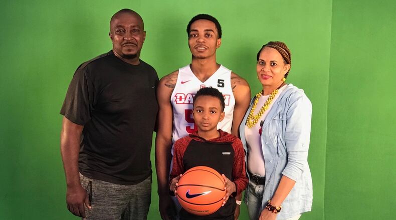 Dayton basketball recruit Rodney Chatman, back center, poses with his family: dad Rodney, left; brother Bryce, with ball; and mom Glenda. Submitted photo