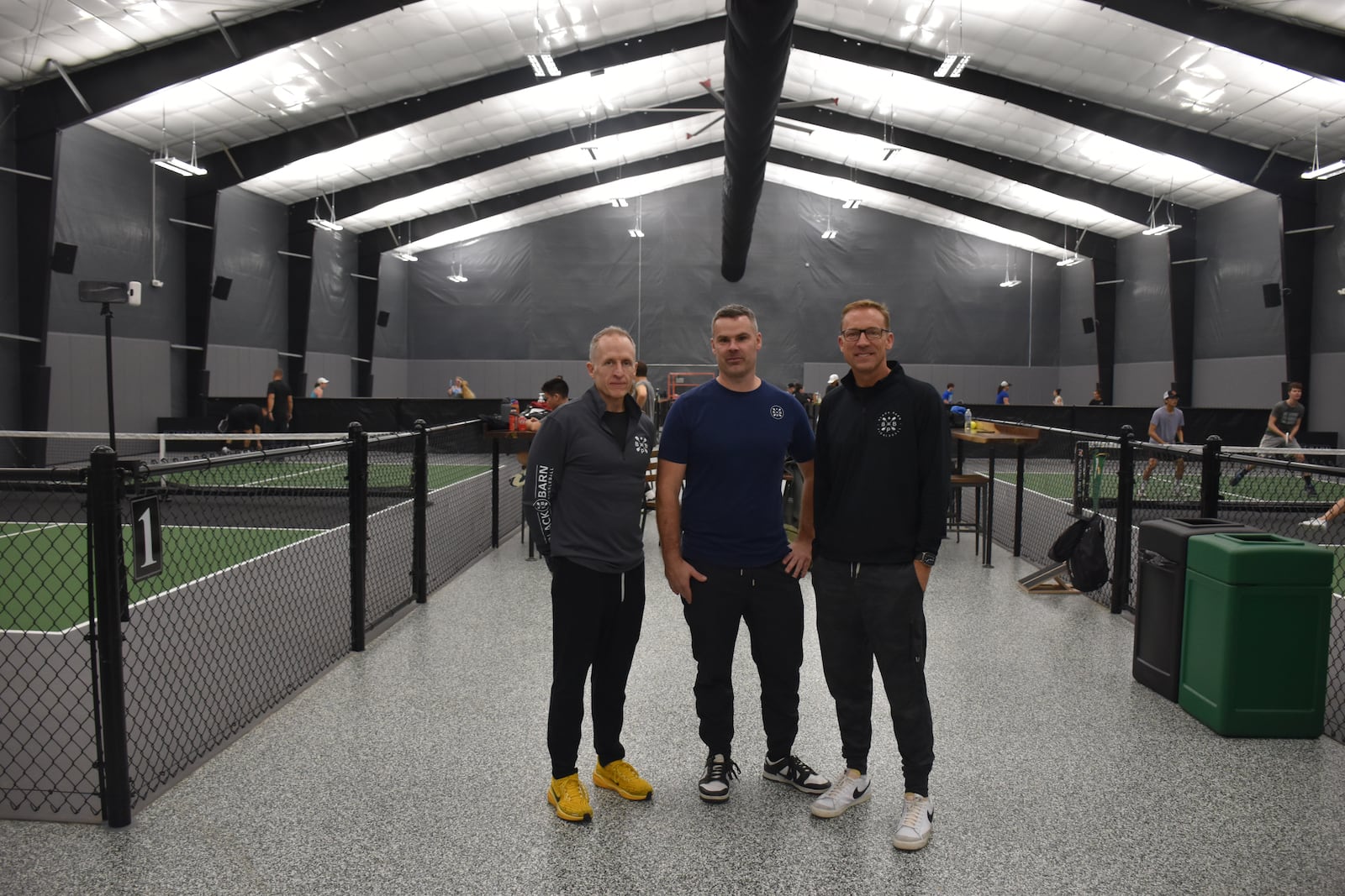 Black Barn Pickleball's co-founders and co-owners (from left) Jeff Jett, Brandon Williamson and Mike Bettencourt. Black Barn has eight courts but plans to add 14 to 18 more. CORNELIUS FROLIK / STAFF