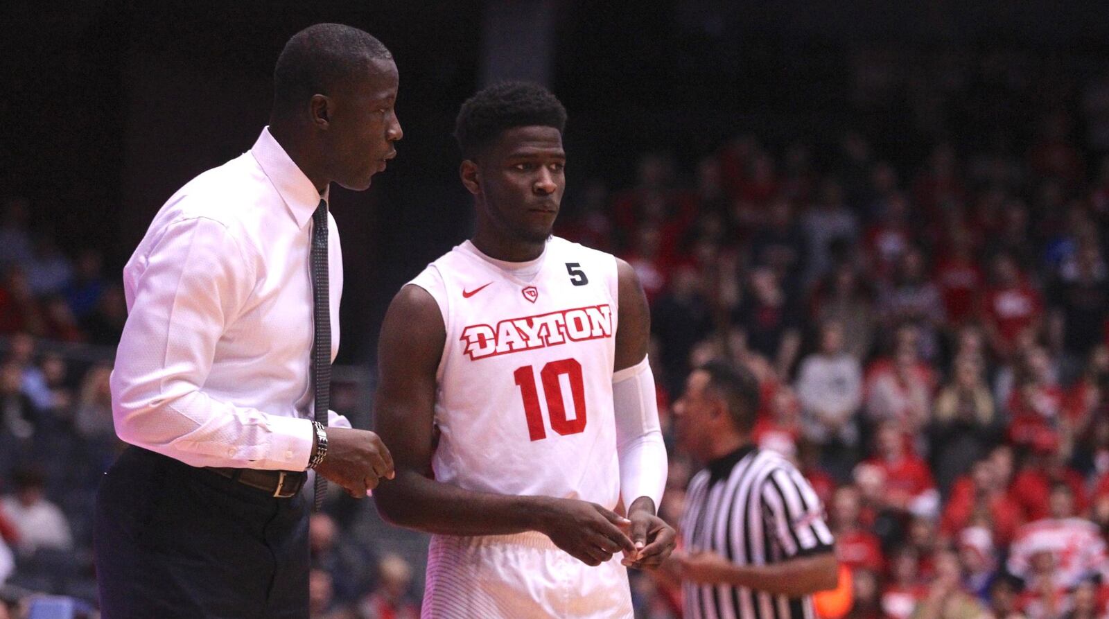 Dayton’s Anthony Grant talks to Jalen Crutcher during a game against Auburn on Wednesday, Nov. 29, 2017, at UD Arena. David Jablonski/Staff