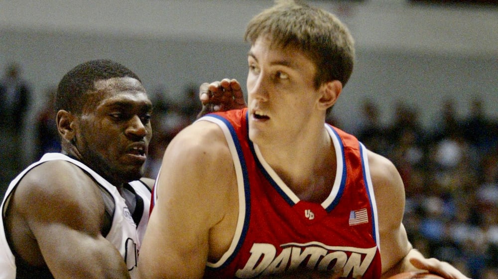 Jason Maxiell, of Cincinnati, left, defends Dayton's Sean Finn in a game in Cincinnati on Dec. 23, 2003. Lisa Powell/Staff