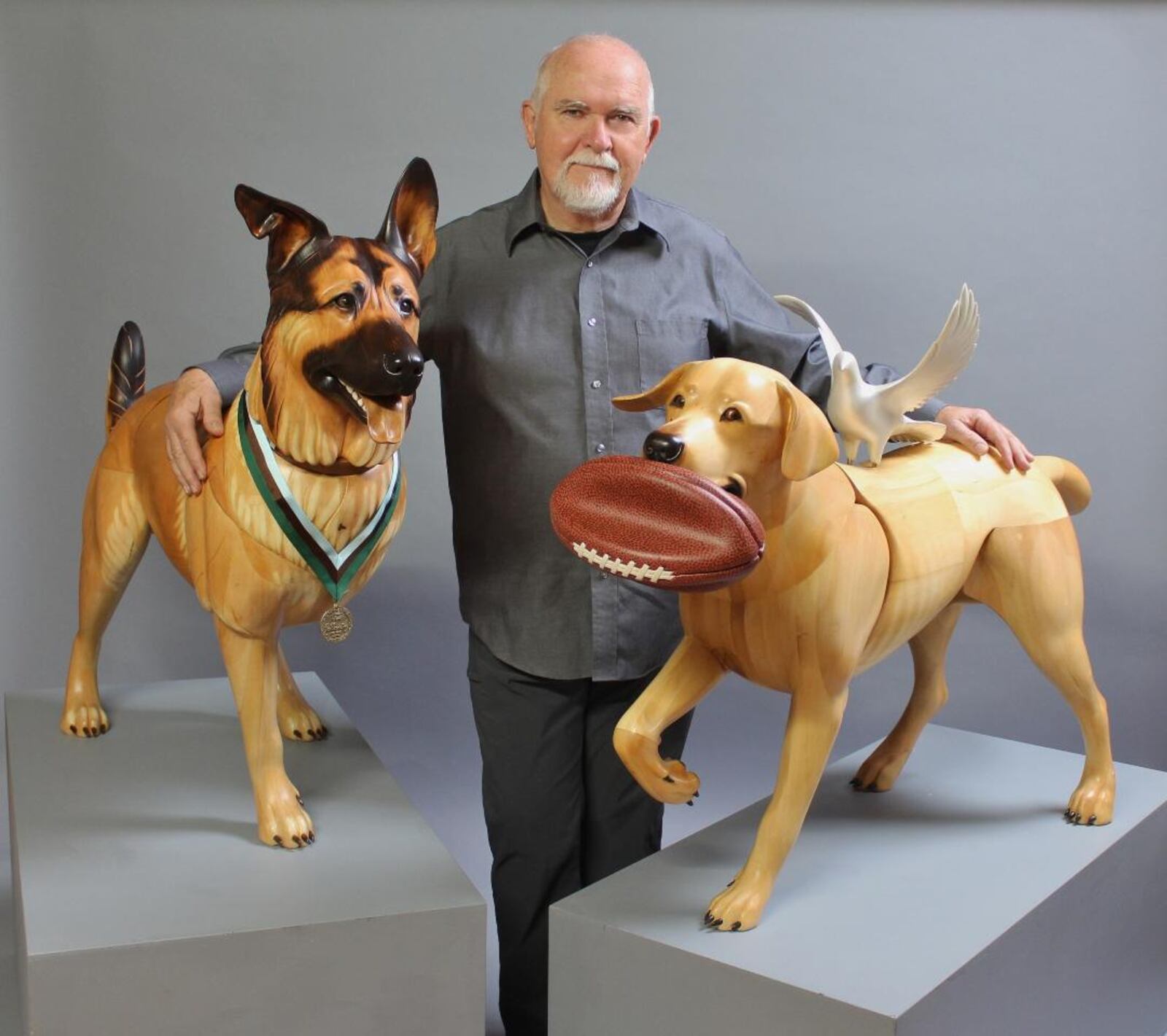 Jim Mellick with Wounded Warrior Dogs Lucca K458 and Cooper K154. CONTRIBUTED