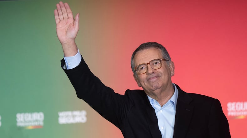 Presidential candidate Antonio Jose Seguro, of the center-left Socialist Party, waves to the crowd during a campaign rally ahead of the Feb. 8 presidential election in Lisbon, Thursday, Feb. 5, 2026. (AP Photo/Ana Brigida)