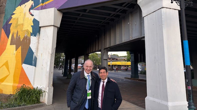 Mircea Geoana, of Romania, and Tino Cuéllar, of California, talk about their evening in Dayton, where they dined at Salar in the Oregon District.