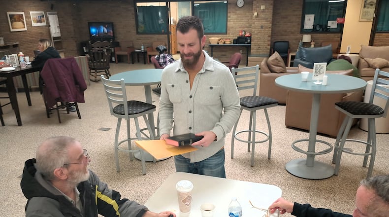 Dustin Fields, a licensed social worker from Emerge Recovery and Trade Center in Xenia, engaging with guests at Bridges of Hope. CONTRIBUTED
