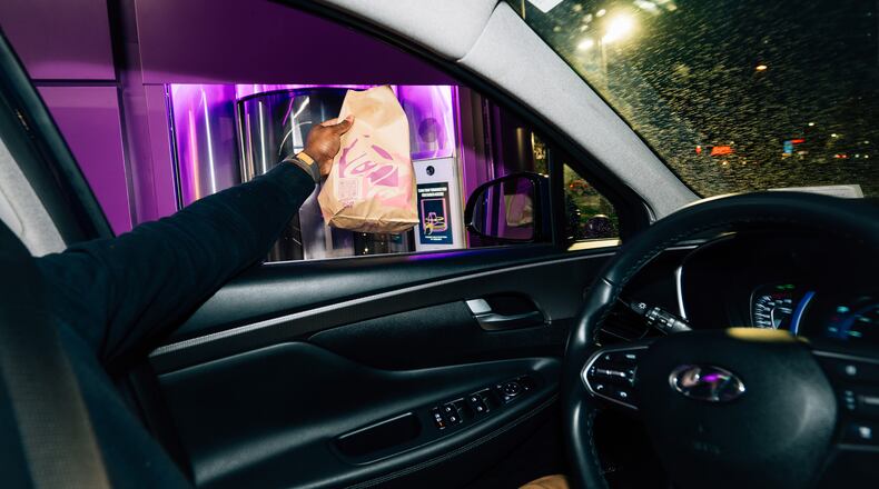 Food is delivered to a waiting car through a system of plastic tubes at Taco Bell’s two-story restaurant in Brooklyn Park outside Minneapolis, Oct. 18, 2023. Taco Bell’s Defy facility is a recent example of “drive-through” optimization. (Nate Ryan/The New York Times)