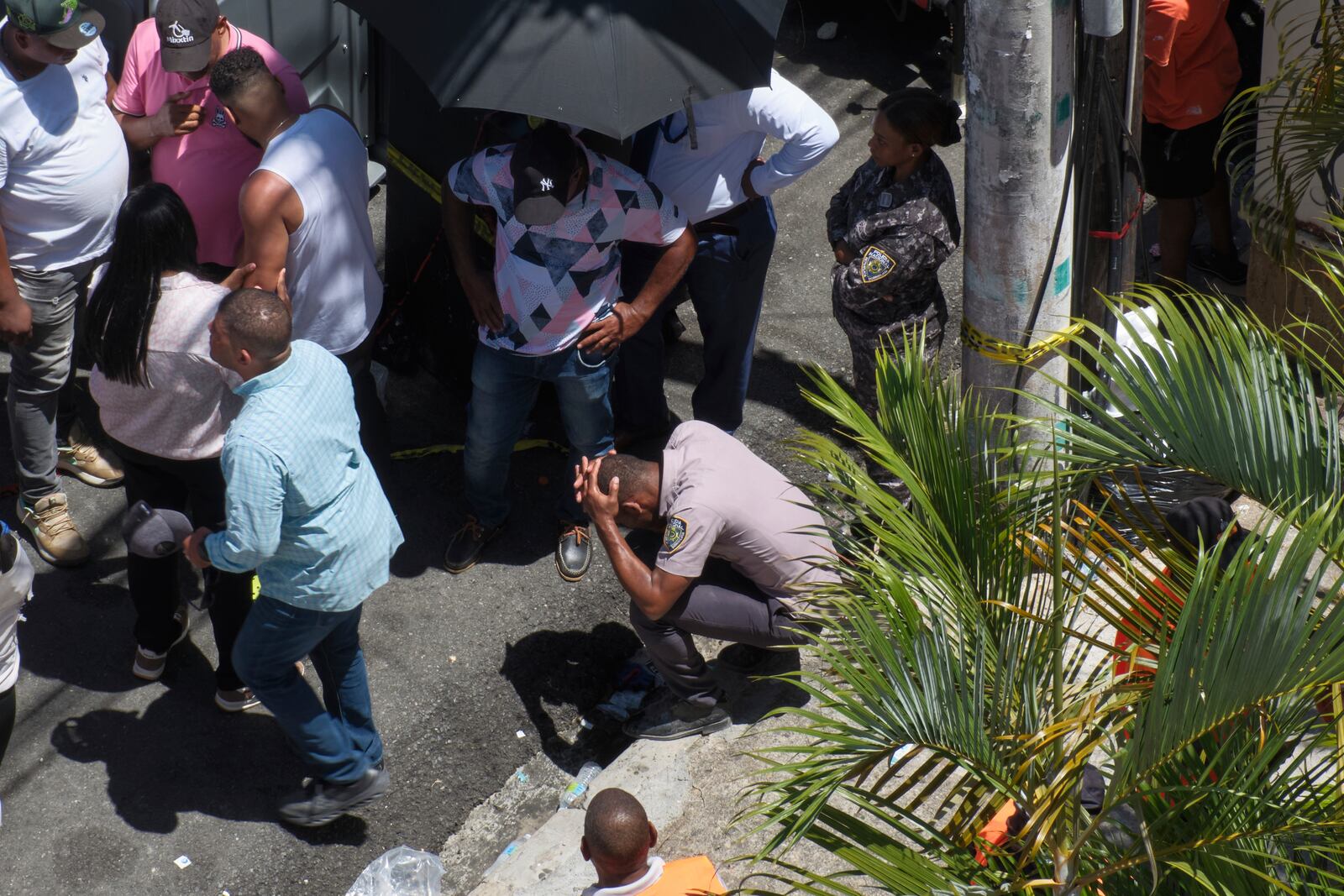 A police officer reacts during the search for survivors at the Jet Set nightclub after its roof collapsed during a concert in Santo Domingo, Dominican Republic, Tuesday, April 8, 2025. (AP Photo/Ricardo Hernandez)