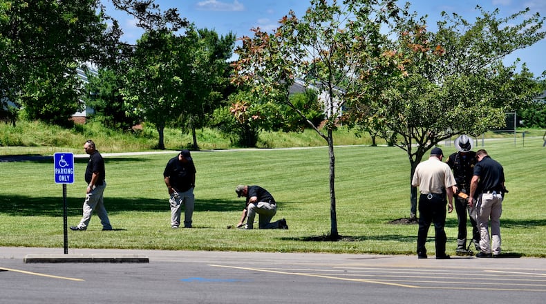 Investigators search Liberty Park in Liberty Twp. for evidence following a fatal shooting there on Wednesday night, June 10, 2020. NICK GRAHAM / STAFF
