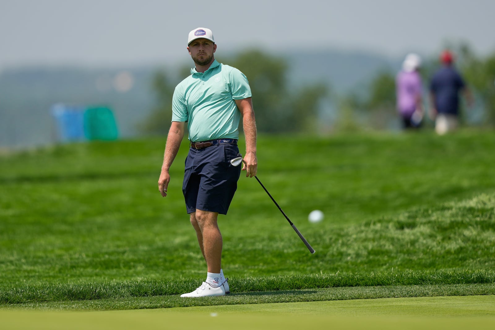 Alistair Docherty chips onto the fourth green during a practice round ahead of the U.S. Open golf tournament at Oakmont Country Club Wednesday, June 11, 2025, in Oakmont, Pa. (AP Photo/Carolyn Kaster)