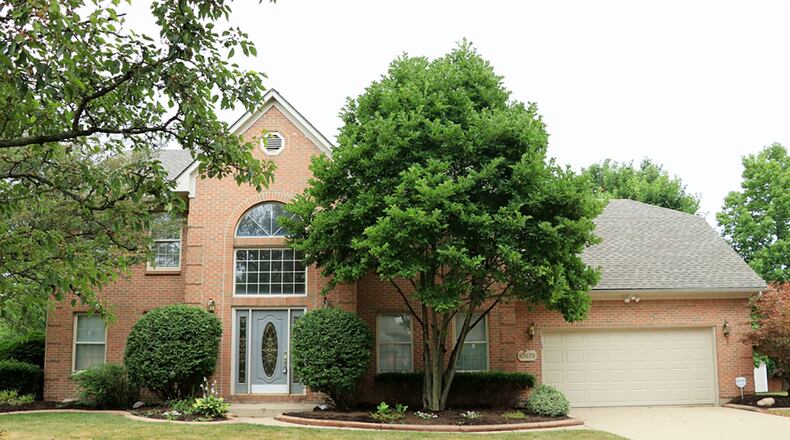 The brick house has about 3,120 sq. ft. of living space plus the finished basement, which includes a recreation room, a bonus room and a half bathroom. Formal entry into the home is made from the concrete walkway into a 2-story foyer with a chandelier and wood flooring CONTRIBUTED PHOTO BY KATHY TYLER