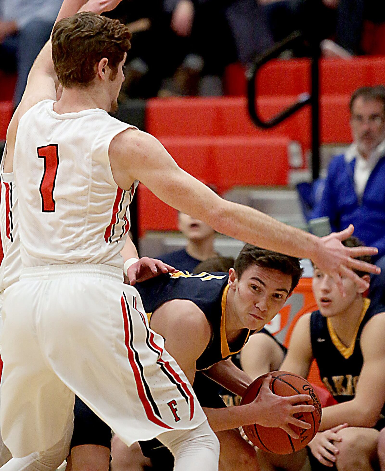 Oakwood’ss Brendan Talarczyk looks for a teammate while being double-teamed by Franklin’s Payton Knott (hidden) and Noah Kremer (1) during Tuesday night’s game at Darrell Hedric Gymnasium in Franklin. CONTRIBUTED PHOTO BY E.L. HUBBARD