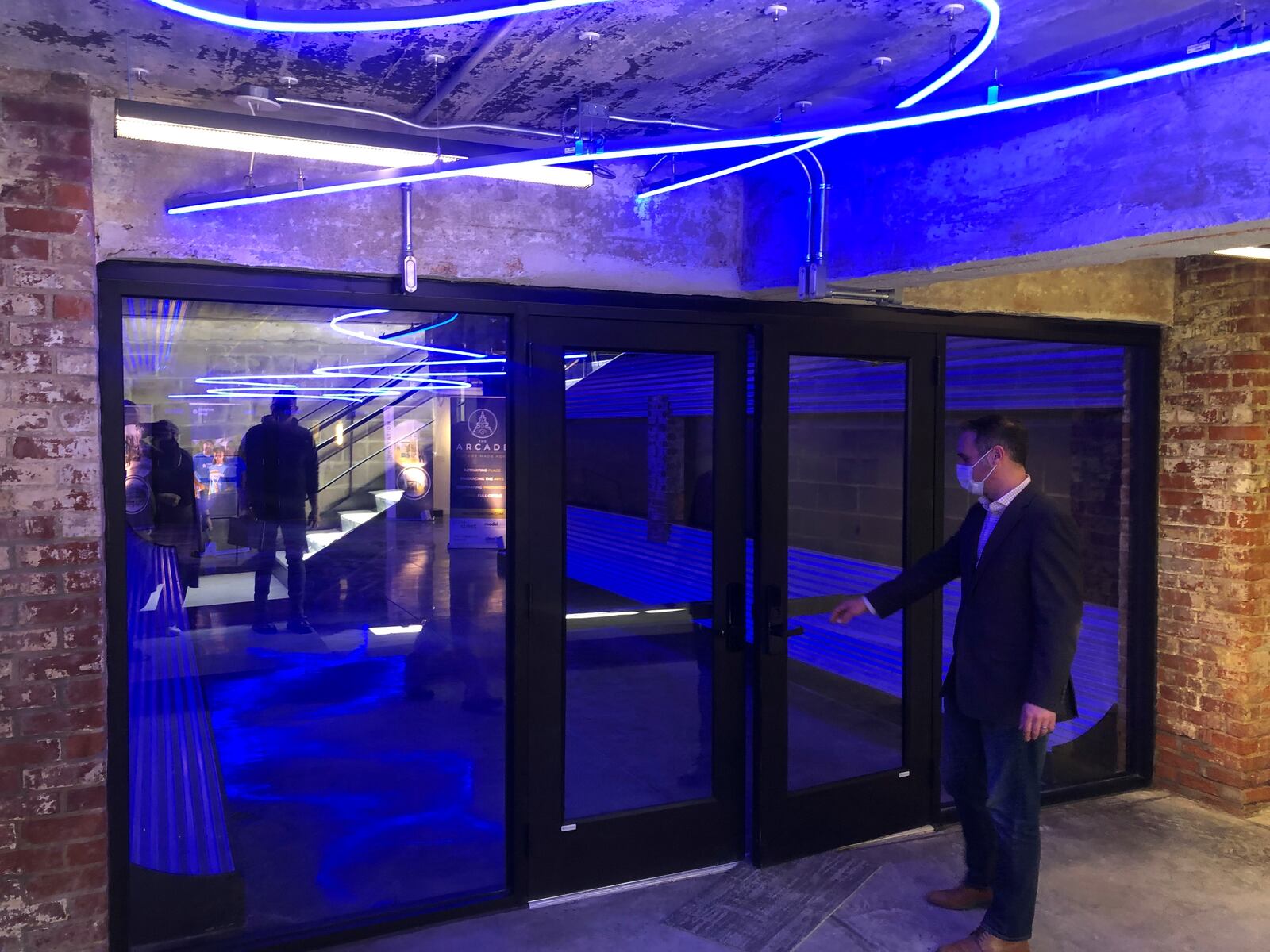 The entry doors on the lower level of the Dayton Arcade into the Tank -- Inspired by CenterPoint Energy. CORNELIUS FROLIK / STAFF