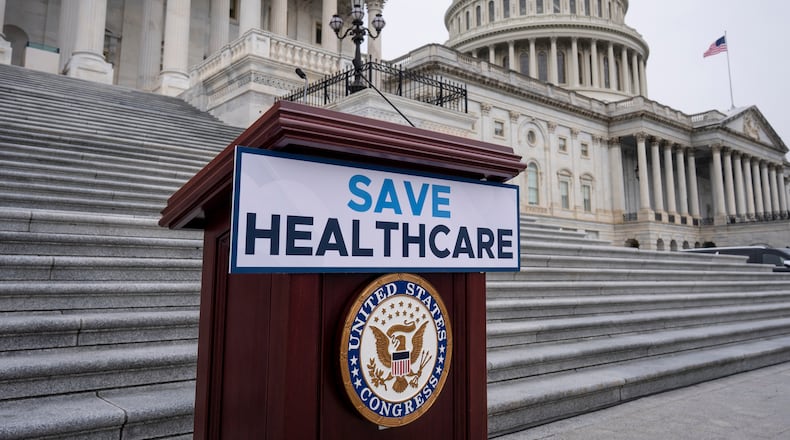 House Democrats prepare to speak on the steps of the Capitol to insist that Republicans include an extension of expiring health care benefits as part of a government funding compromise, in Washington, Tuesday, Sept. 30, 2025. (AP Photo/J. Scott Applewhite)